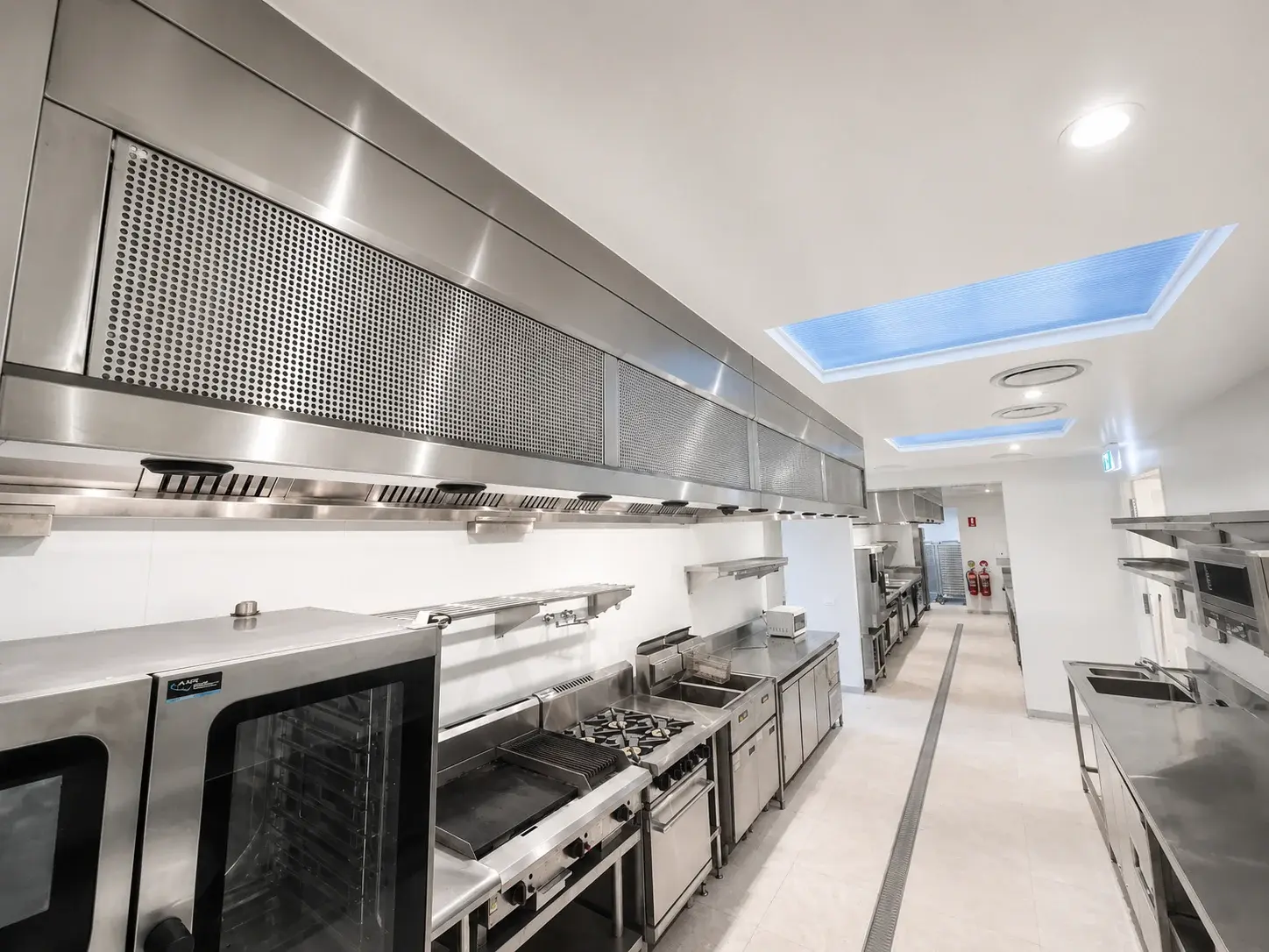 Chef working under commercial ventilation hood